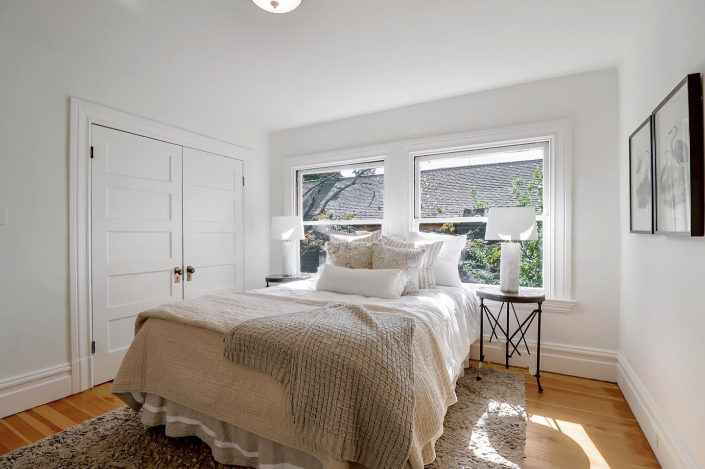 2614 Etna Street Berkeley, CA 94704 - Photo 30 of 59 a bedroom with a bed and large window