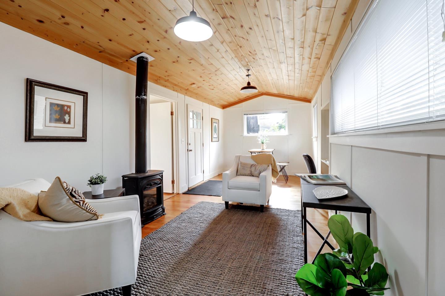 2614 Etna Street Berkeley, CA 94704 - Photo 40 of 59 a living room with furniture and a potted plant