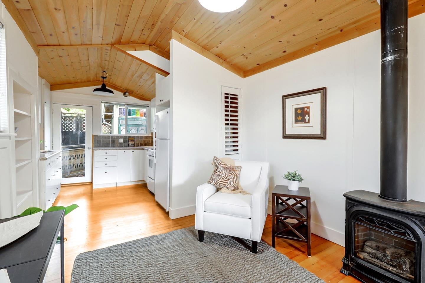 2614 Etna Street Berkeley, CA 94704 - Photo 41 of 59 a living room with furniture and a fireplace