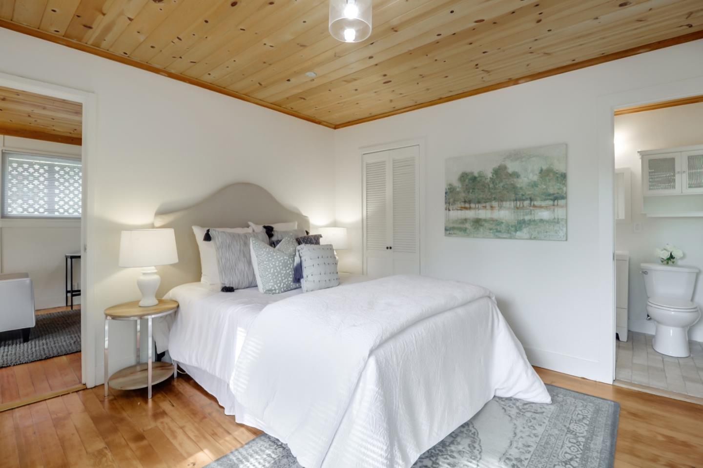 2614 Etna Street Berkeley, CA 94704 - Photo 46 of 59 a bedroom with a bed and a view of bathroom