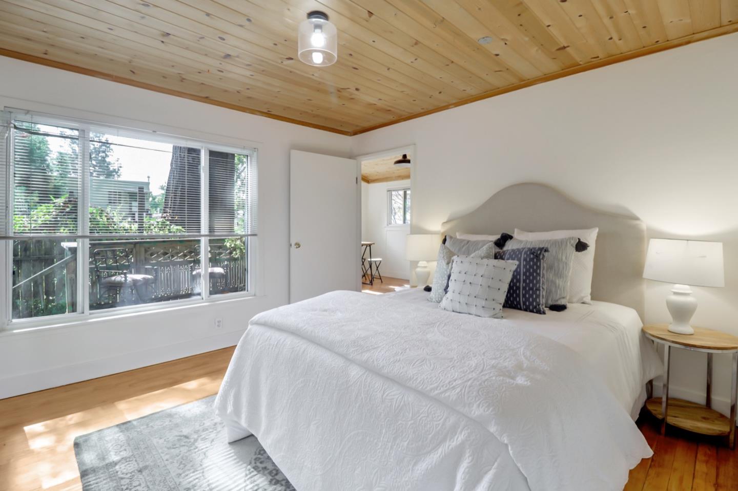 2614 Etna Street Berkeley, CA 94704 - Photo 47 of 59 a large bed sitting in a bedroom next to a window