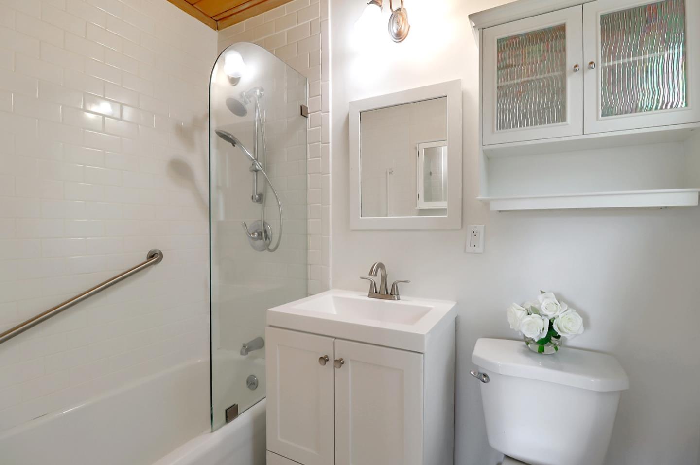 2614 Etna Street Berkeley, CA 94704 - Photo 48 of 59 a bathroom with a sink a toilet and shower