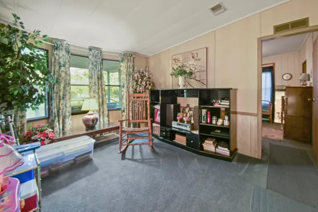 a children room with furniture and a floor to ceiling window