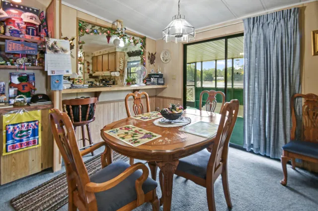 a living room with furniture gym equipment and a window