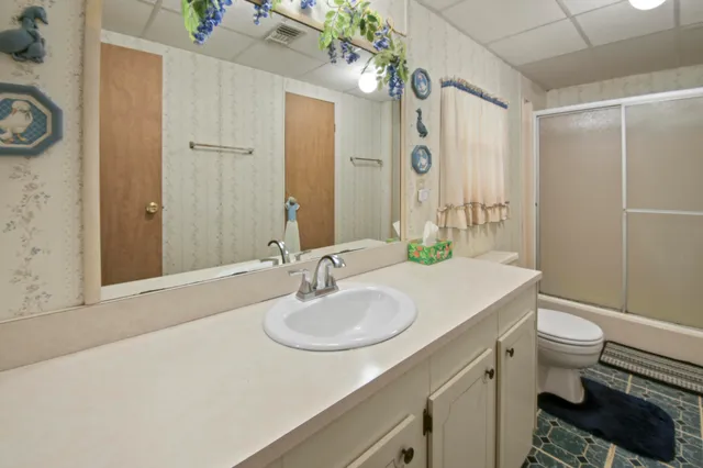 a bedroom with bed and a tv