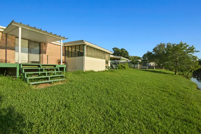 a view of a lake with a yard