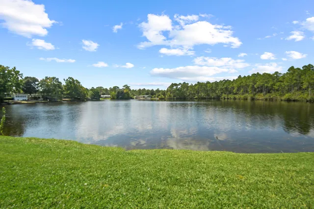 a view of a lake in between the city and lake