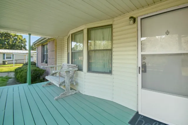 a room with furniture and a flat screen tv