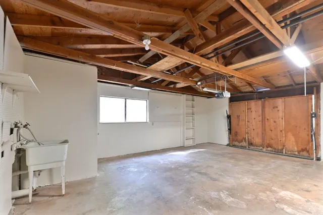 a view of a room with wooden walls