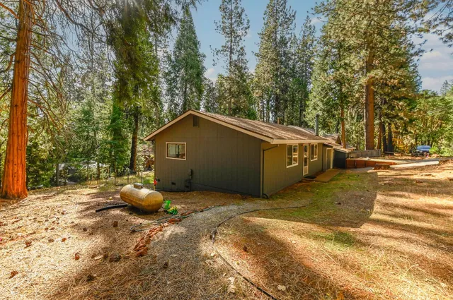 a view of backyard with green space