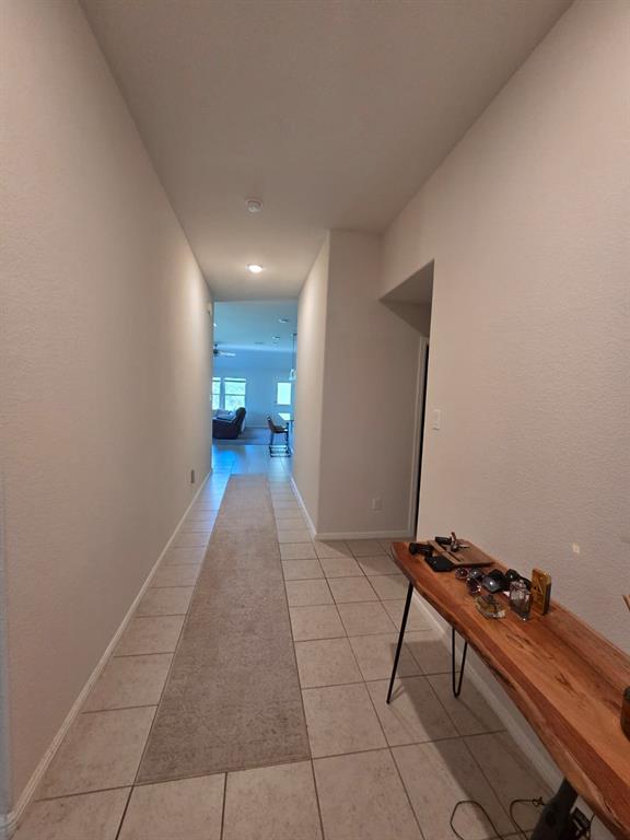 1512 Springtree Drive McKinney, TX 75071 - Photo 3 of 23 a hallway with a view of kitchen appliances