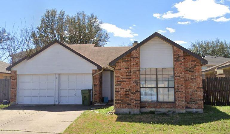 330 Valley Spring Drive Arlington, TX 76018 - Photo 2 of 2 a view of a house with a yard and garage