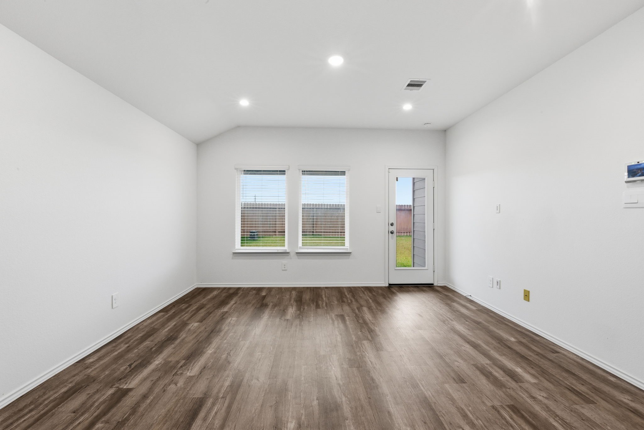 24343 Saddlestone Green Drive Spring, TX 77373 - Photo 12 of 43 a view of an empty room with wooden floor and a window