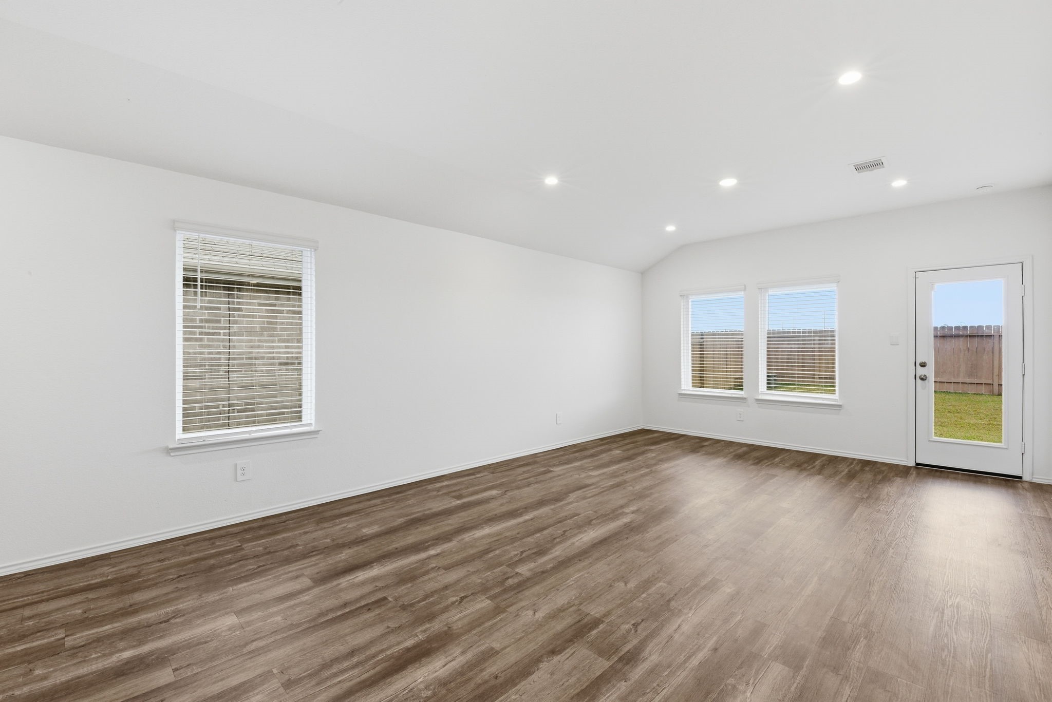 24343 Saddlestone Green Drive Spring, TX 77373 - Photo 17 of 43 a view of an empty room with wooden floor and a window