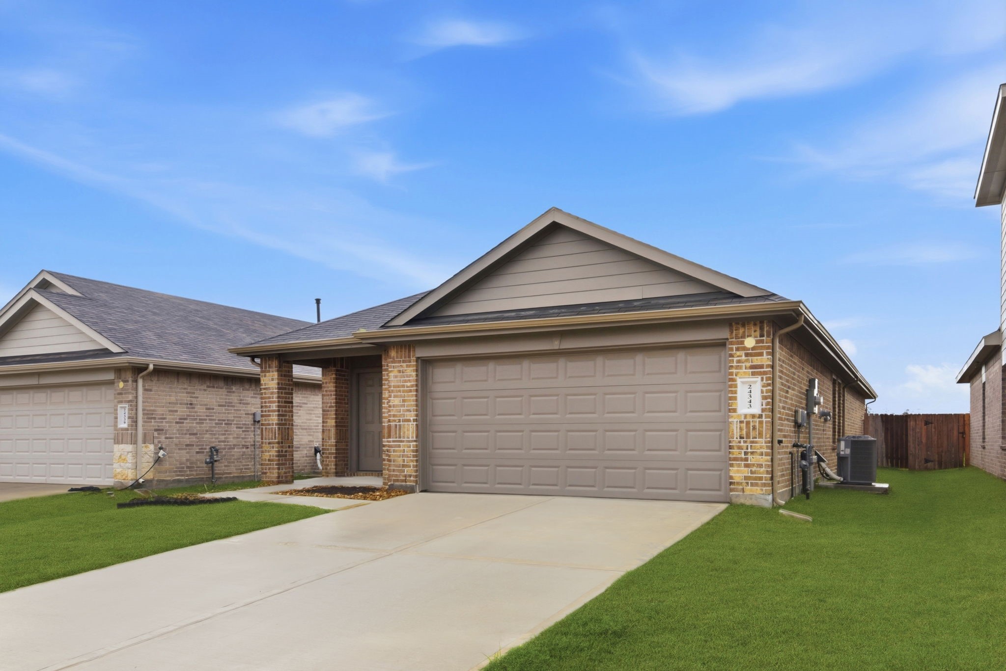 24343 Saddlestone Green Drive Spring, TX 77373 - Photo 3 of 43 a front view of a house with a yard and garage