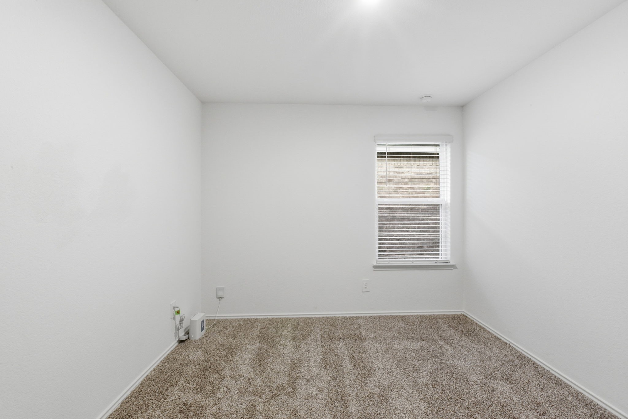 24343 Saddlestone Green Drive Spring, TX 77373 - Photo 33 of 43 an empty room with a window