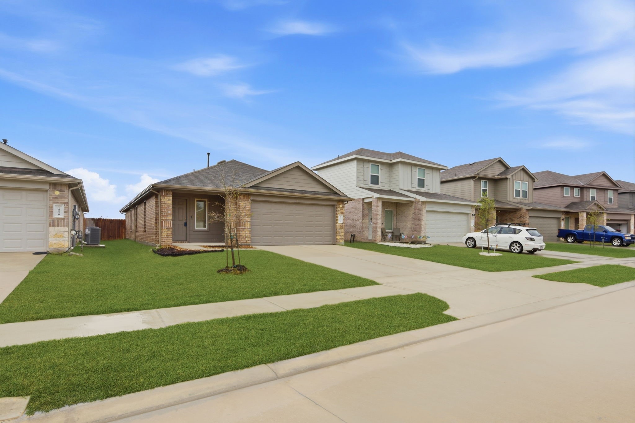 24343 Saddlestone Green Drive Spring, TX 77373 - Photo 4 of 43 a front view of a house with a yard and garage