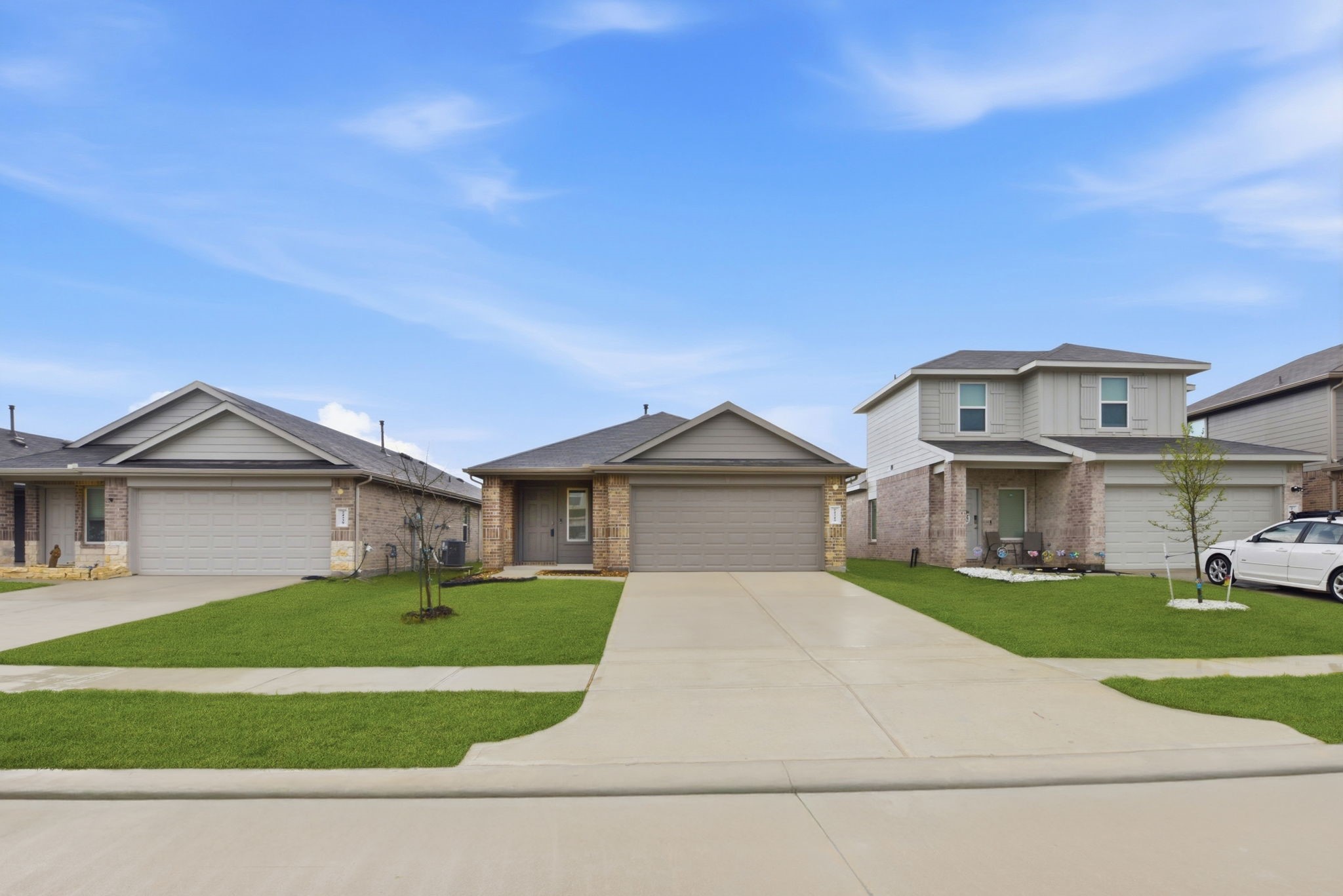 24343 Saddlestone Green Drive Spring, TX 77373 - Photo 5 of 43 a front view of a house with a garden and yard