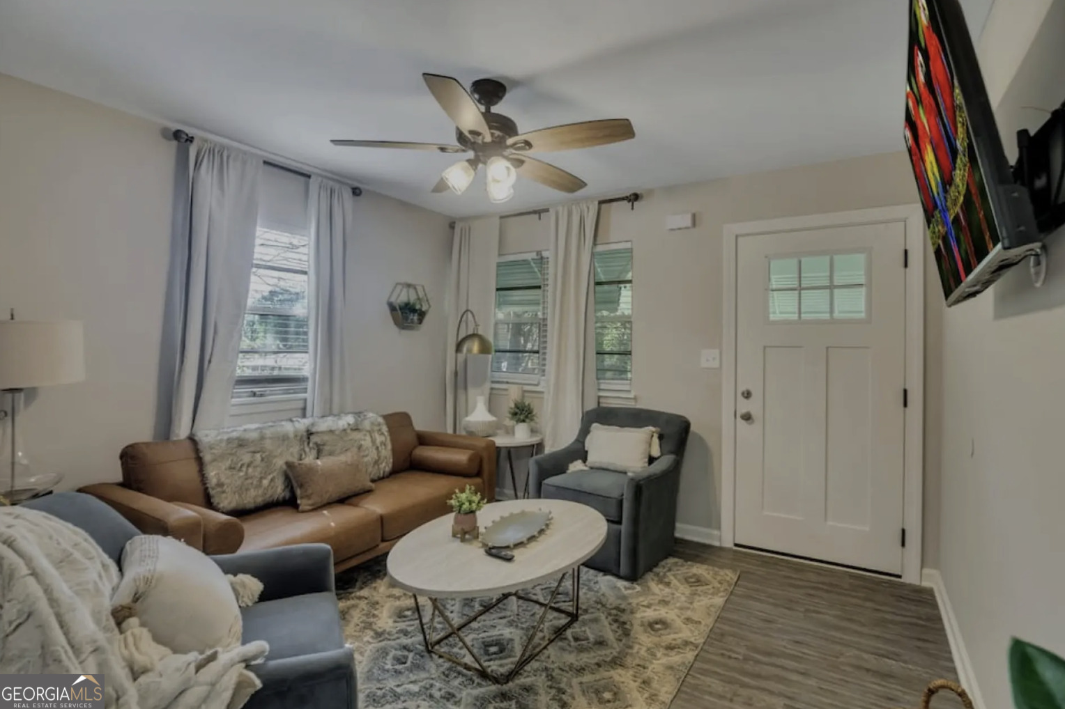 50 Oak Street Hiram, GA 30141 - Photo 1 of 16 a living room with furniture a ceiling fan and a window