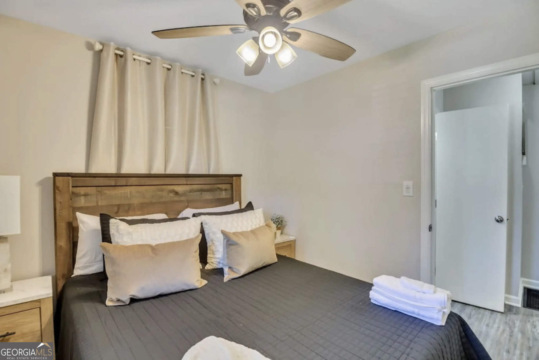 50 Oak Street Hiram, GA 30141 - Photo 14 of 16 a living room with furniture and a chandelier