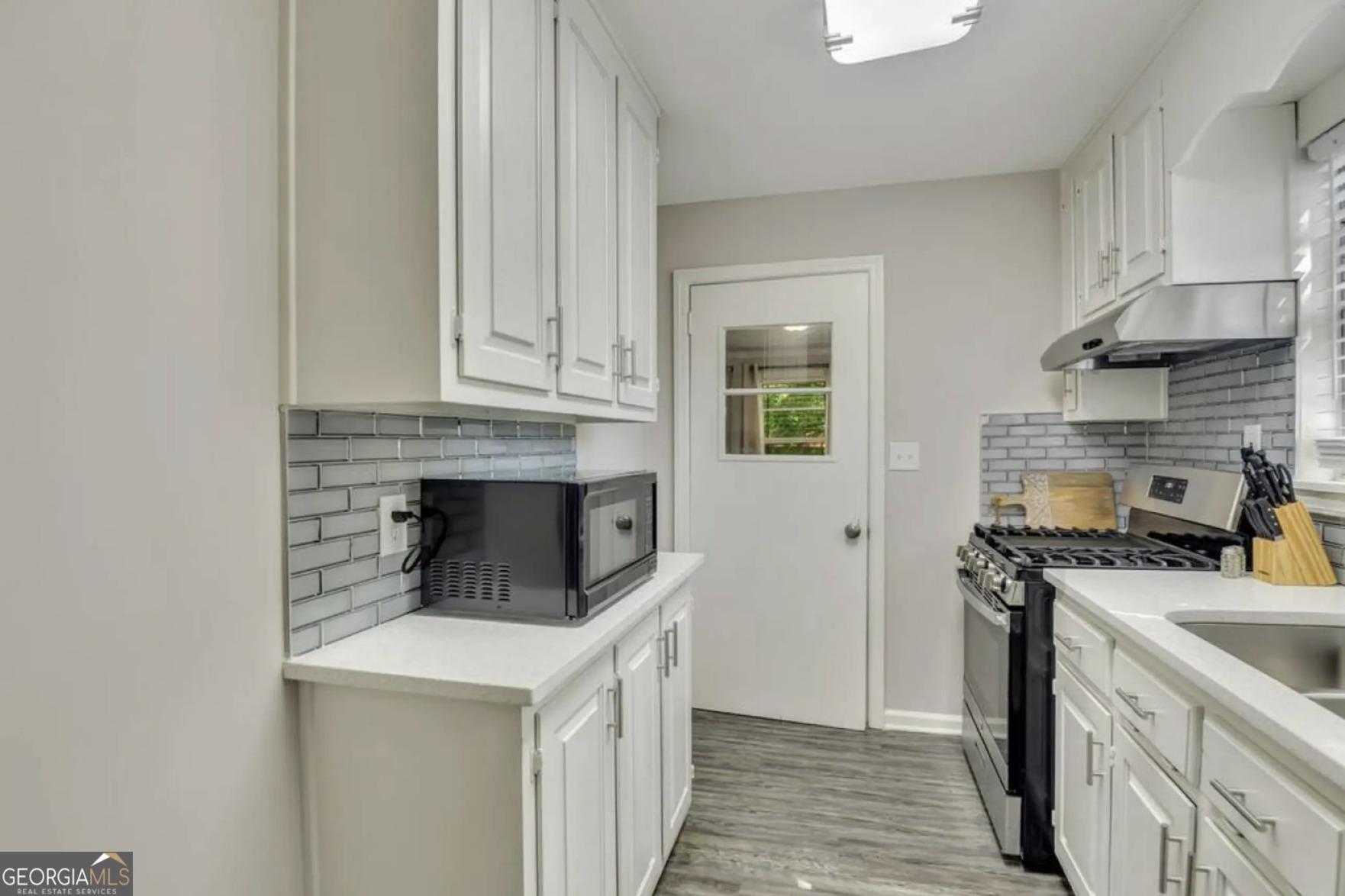 50 Oak Street Hiram, GA 30141 - Photo 5 of 16 a kitchen with stainless steel appliances granite countertop a stove and a sink