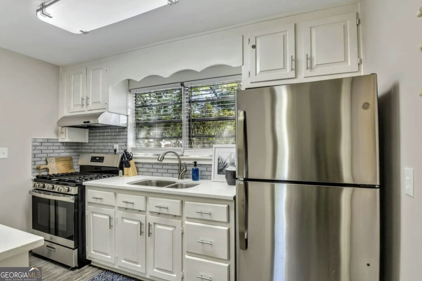 50 Oak Street Hiram, GA 30141 - Photo 6 of 16 a kitchen with stainless steel appliances granite countertop a refrigerator stove and cabinets
