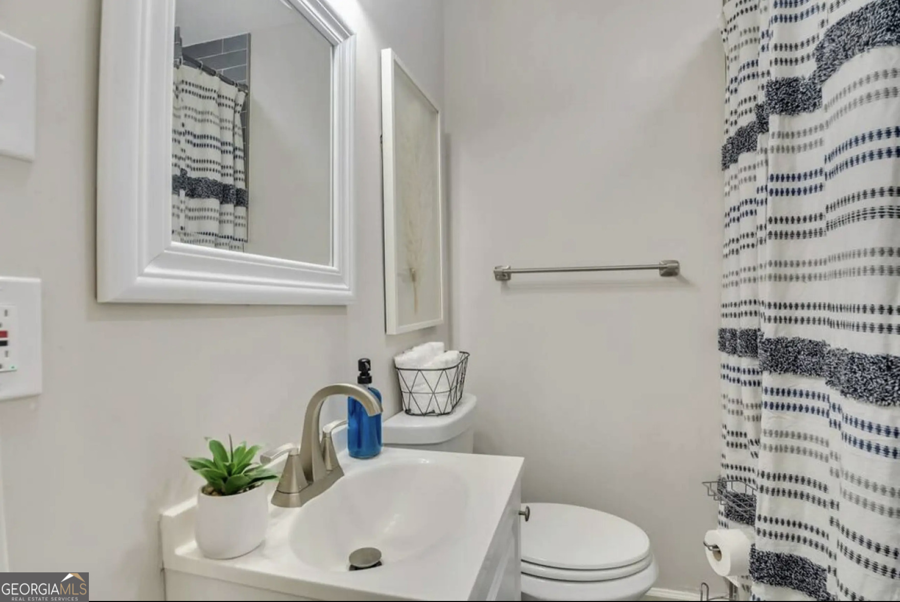 50 Oak Street Hiram, GA 30141 - Photo 9 of 16 a bathroom with a sink a toilet and shower