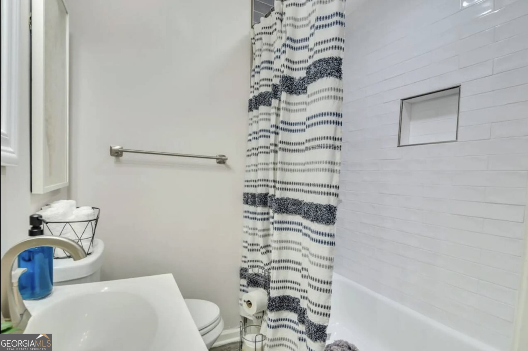 50 Oak Street Hiram, GA 30141 - Photo 10 of 16 a bathroom with a toilet and a shower