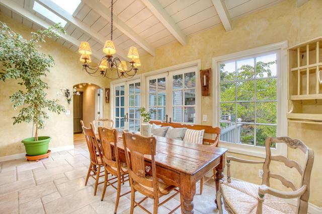 655 Bayview Drive Aptos, CA 95003 - Photo 11 of 48 a dining room with furniture a chandelier and a rug
