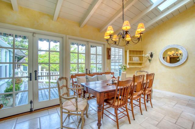 655 Bayview Drive Aptos, CA 95003 - Photo 12 of 48 a dining room with chandelier and wooden floor