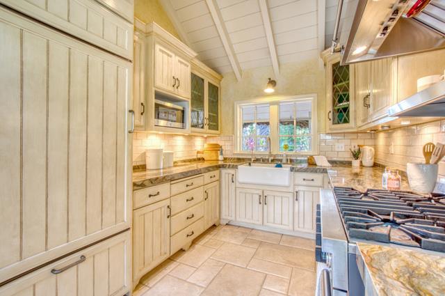 655 Bayview Drive Aptos, CA 95003 - Photo 15 of 48 a kitchen with stainless steel appliances granite countertop a stove and a sink