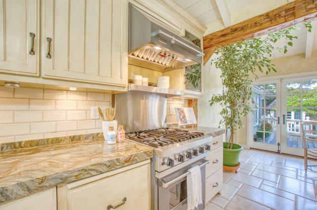655 Bayview Drive Aptos, CA 95003 - Photo 16 of 48 a kitchen with a stove a sink and a refrigerator