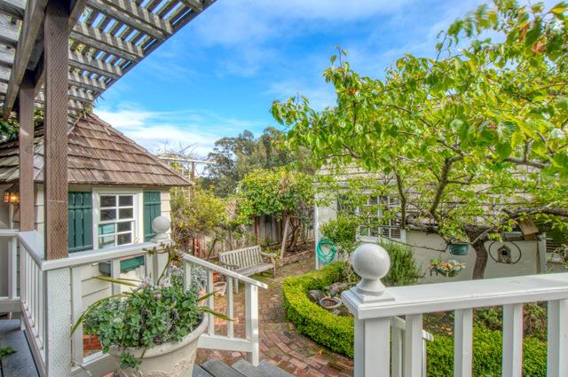655 Bayview Drive Aptos, CA 95003 - Photo 24 of 48 a view of a patio with table and chairs and potted plants