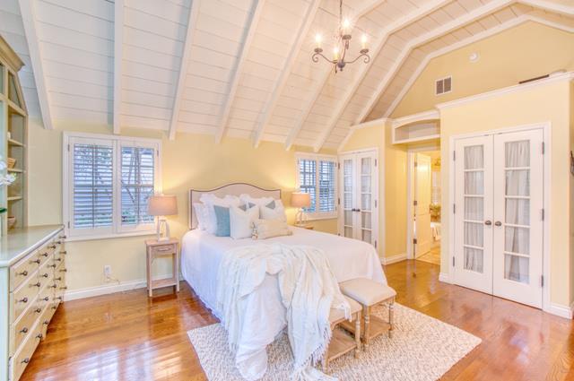 655 Bayview Drive Aptos, CA 95003 - Photo 29 of 48 a bedroom with a bed and wooden floor