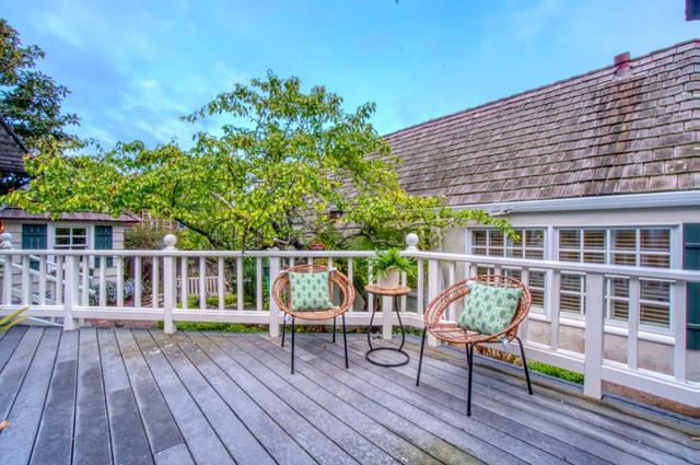 655 Bayview Drive Aptos, CA 95003 - Photo 35 of 48 a balcony with wooden floor table and chairs