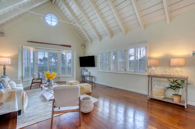 655 Bayview Drive Aptos, CA 95003 - Photo 8 of 48 a living room with furniture a flat screen tv and wooden floor