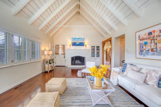 655 Bayview Drive Aptos, CA 95003 - Photo 9 of 48 a living room with furniture a fireplace and potted plants