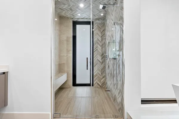 a view of an entryway with floor to ceiling window and an outdoor space