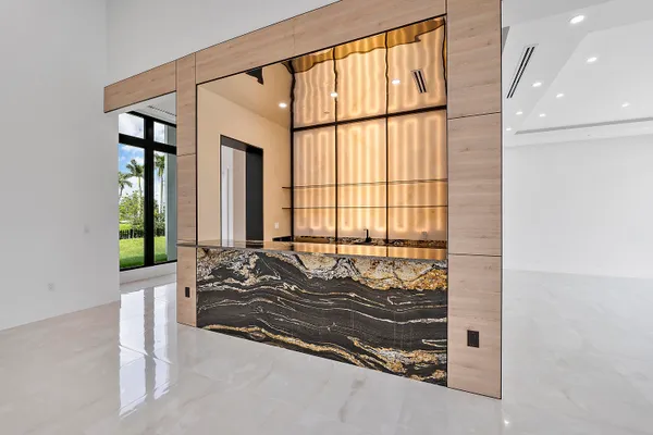 a kitchen with a sink stainless steel appliances a counter top space