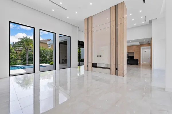 an empty room with closet and wooden floor