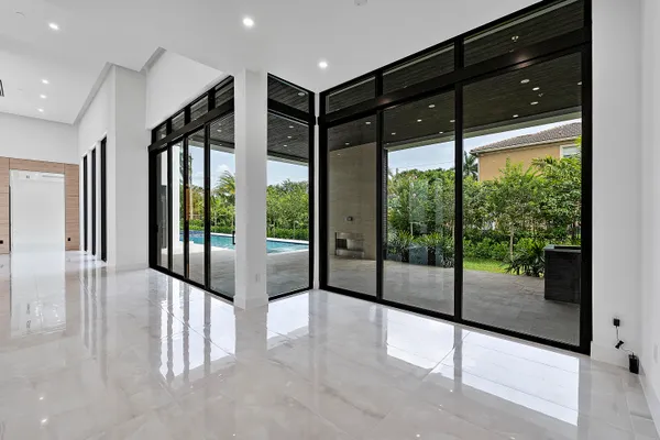a view of a house with a backyard