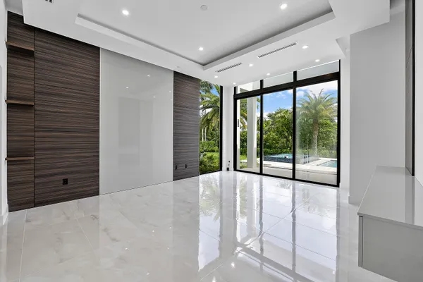 a spacious bathroom with a double vanity sink a mirror and a bathtub