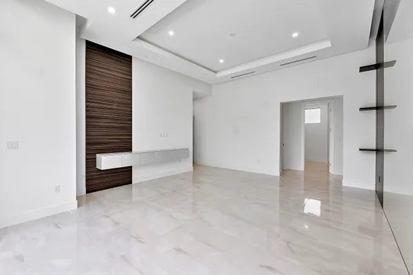 a spacious bathroom with a double vanity sink and a mirror