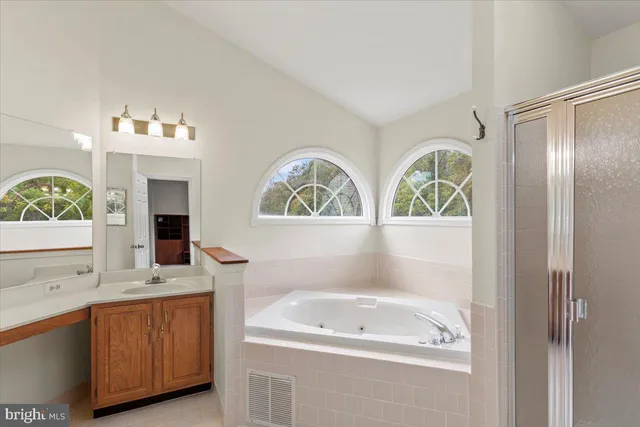 a living room with furniture and a ceiling fan