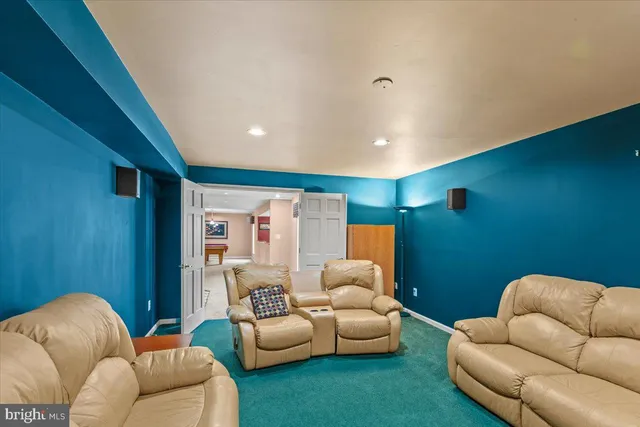 a view of a big house with a big yard and large trees