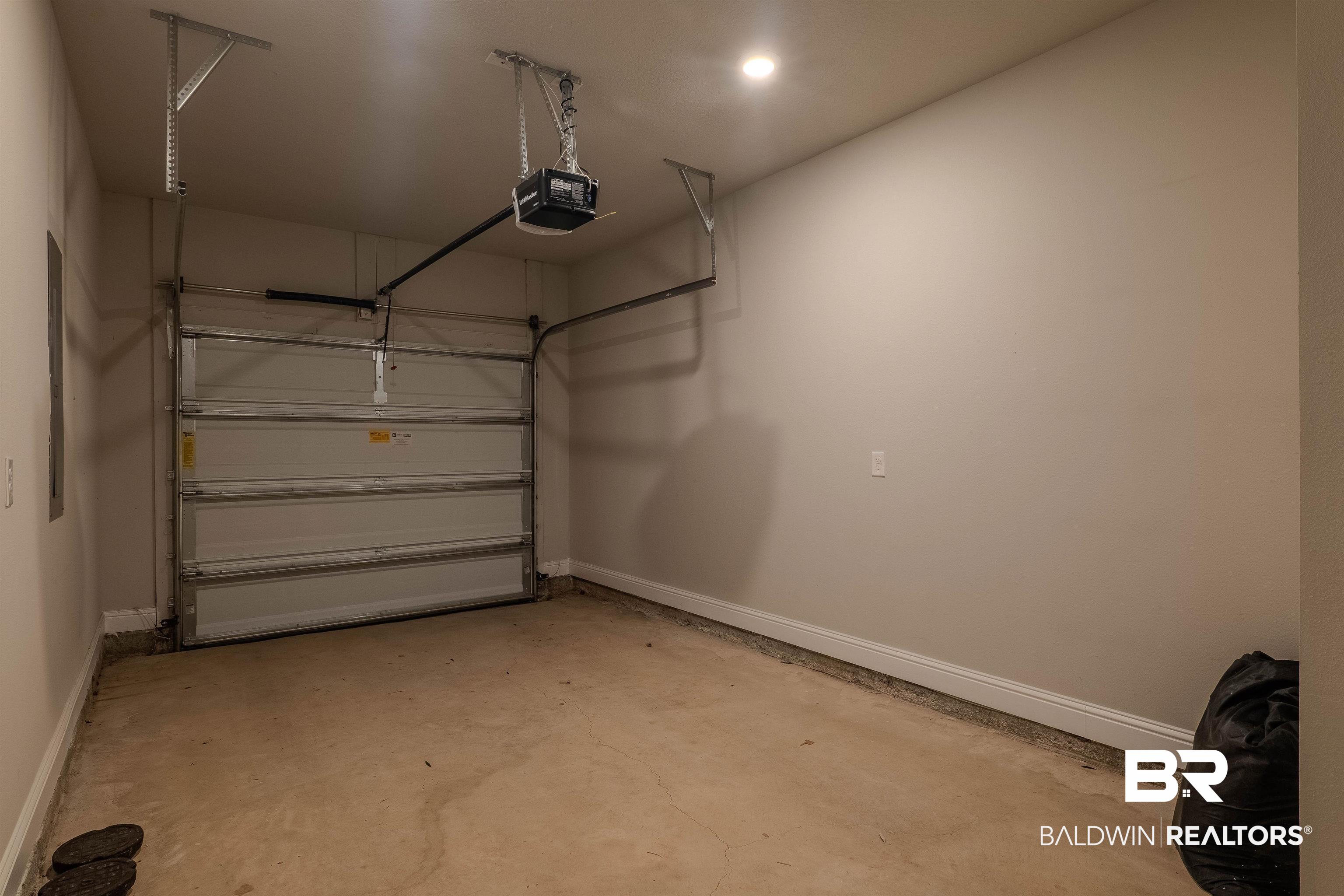 25806 Pollard Road, Unit 32 Daphne, AL 36526 - Photo 19 of 23 Garage with a garage door opener