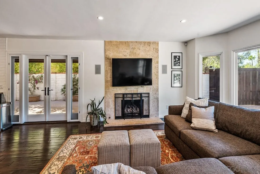13060 Camino Del Valle Poway, CA 92064 - Photo 23 of 75 a living room with furniture a fireplace and a flat screen tv