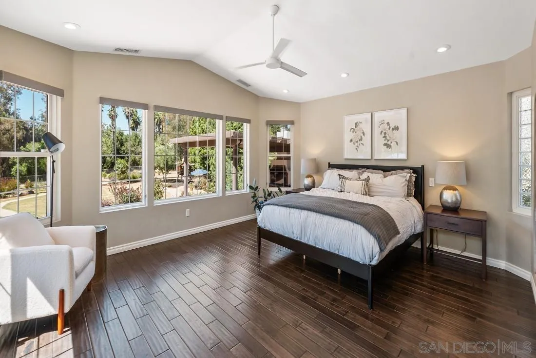 13060 Camino Del Valle Poway, CA 92064 - Photo 28 of 75 a bedroom with a large bed couch and a large window