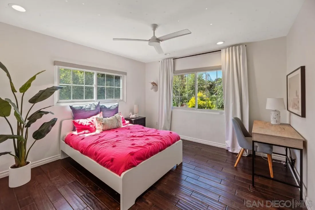 13060 Camino Del Valle Poway, CA 92064 - Photo 39 of 75 a bedroom with a bed and a table in it