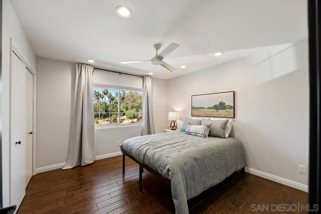 13060 Camino Del Valle Poway, CA 92064 - Photo 43 of 75 a bedroom with a large bed and a window